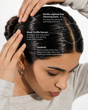 A woman with her hair parted down the middle, showing a clean, highlighted section. Text overlays describe the benefits of the hair treatment: 'Gentle sulphate-free cleansing base', 'Black Truffle Extract', and 'Linalool'.